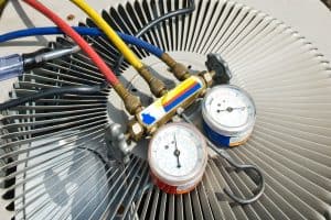 refrigerant gauges on top of exterior air conditioner